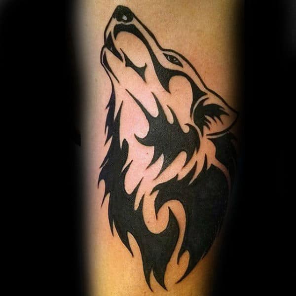 gentleman-with-cool-tribal-wolf-forearm-tattoo